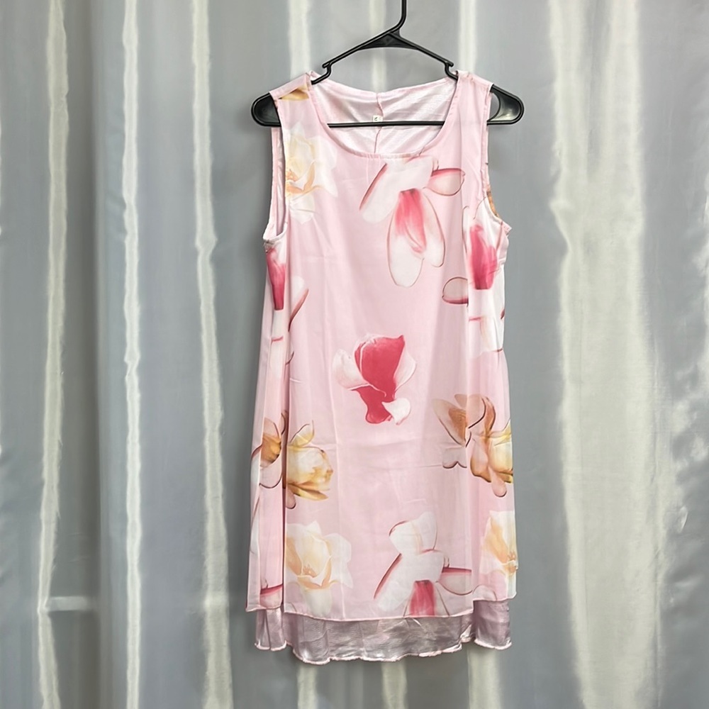 Women’s pretty sleeveless dress. New but no tags except M.  Sorry